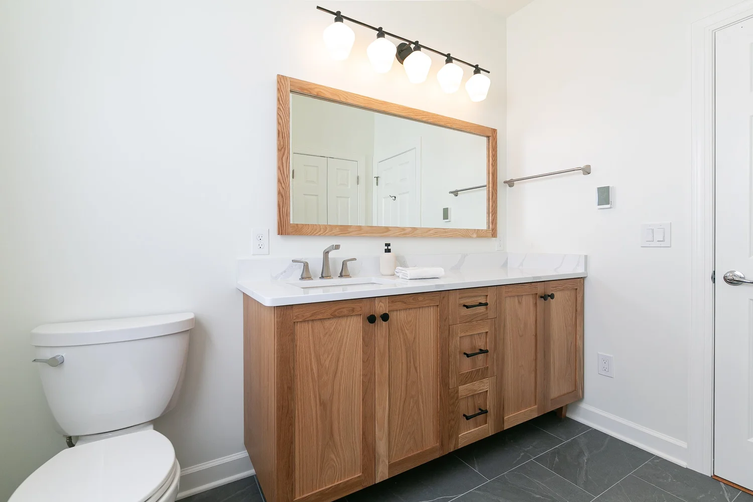 Perspective showing coordinated materials and finishes from Bathroom Remodel — Holly Grove Williamsburg Virginia by VanFleet Homes
