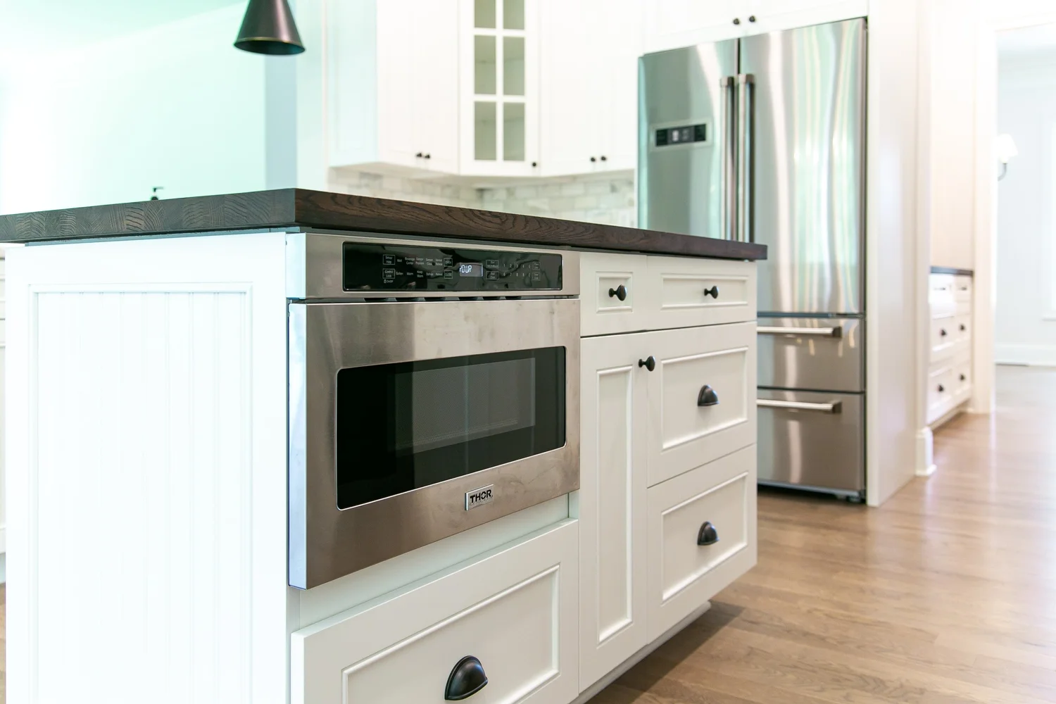 Perspective showing coordinated materials and finishes from Kitchen Remodel — Charles City by VanFleet Homes