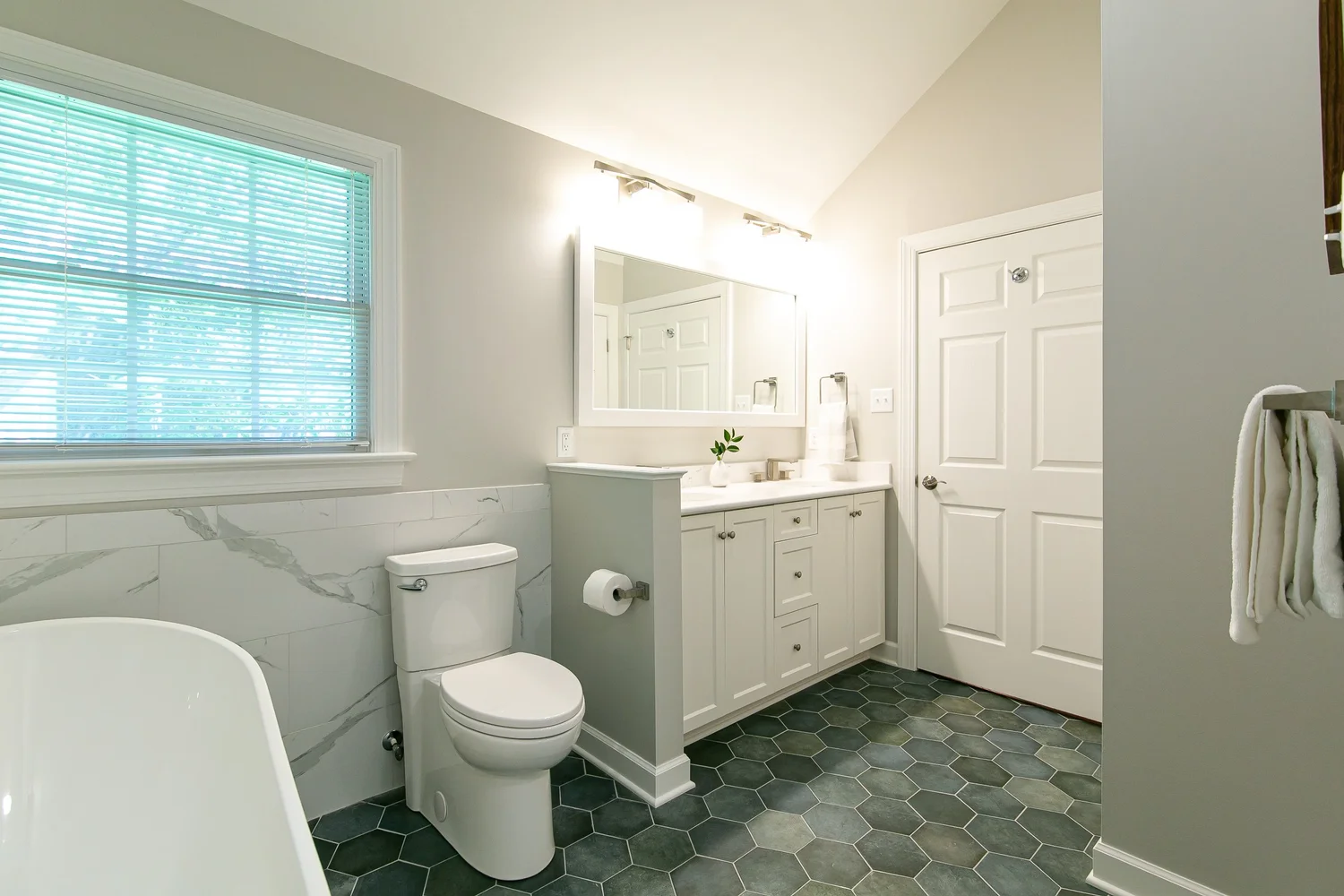 Perspective showing coordinated materials and finishes from Bathroom Remodel — Powhatan Williamsburg Virginia by VanFleet Homes